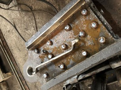 Having drilled out the rivets to release the axlebox brasses, we weld nuts to the remains of the stud so that they can be unscrewed easily.
