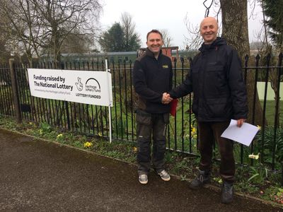 Project Manager, Gary Amos (right) shaking hands with our builder.