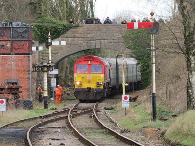 Railtours diesel approaches the platform - quite a crowd gathered on the bridge to watch and photograph the event.