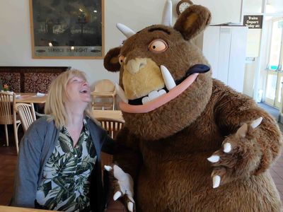 Gruffalo shares a joke with one of our visitors in the cafe