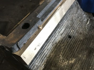 This photo shows one of the inserts in position and a bronze dowel pin fitted to secure it in place. The bearing surface will be machined to suit the journal after the rest of the bearing has been white metalled.