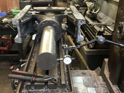 Matt sets up the first crosshead on the milling machine. We have made a dummy piston rod which is used to ensure the white metal surfaces are machined in line with the centreline.
